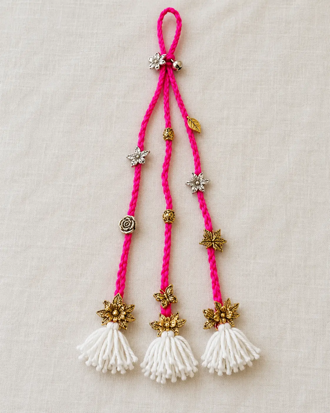 Pink paranda woven into a dark braid