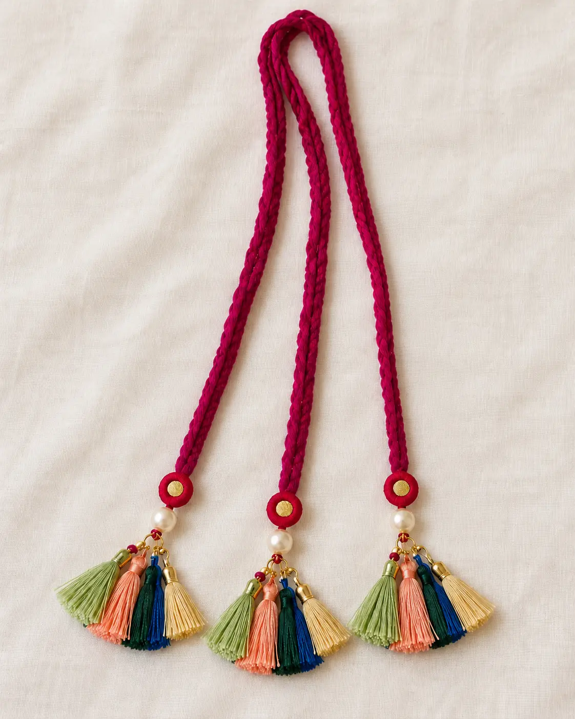 Magenta braided paranda with pearl tassels